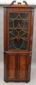 A 19th century glazed mahogany standing corner cabinet. 215 cm high.