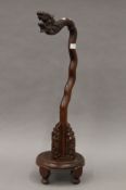 An early 20th century Chinese carved wooden lamp base. 74 cm high.