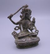 A small bronze model of Buddha. 8 cm high.