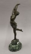 A patinated bronze model of an Art Deco dancing lady, signed S MELANI,