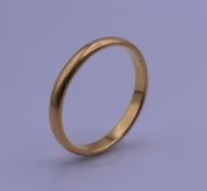 A 22 ct gold wedding band. 3 grammes.