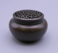 A small Chinese bronze pierced top censer. 3 cm high.