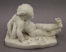 A carved marble figure of a child and a crab. 33 cm long, 18.5 cm wide, 23.5 cm high.