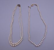 Two pearl necklaces, each with a 9 ct gold clasp.