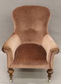 A Victorian mahogany framed spoon back arm chair. 81 cm wide.