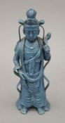 A Chinese blue porcelain model of Guanyin. 24 cm high.