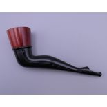 A wood bowled novelty pipe in the form of a lady's shapely leg. 13.5 cm long.