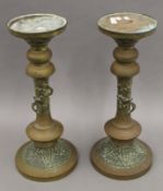 A pair of 19th century Japanese brass stands. Each 54.5 cm high.