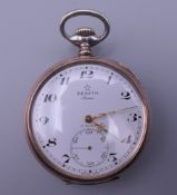 A Zenith silver pocket watch. 5 cm wide.