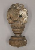 An 18th century and possibly earlier, carved oak finial. 25 cm high.