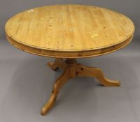 A modern pine kitchen table. 124 cm diameter.