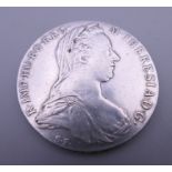 A Maria Theresa 1 Thaler silver coin.