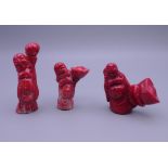 Three carved coral figures. The largest 7.5 cm high.