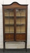 An Edwardian inlaid mahogany display cabinet. 180 cm high.