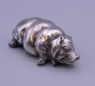 A silver model of a pig, bearing Russian marks. 7 cm long. 65.9 grammes total weight.