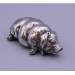 A silver model of a pig, bearing Russian marks. 7 cm long. 65.9 grammes total weight.