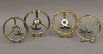 Four Victorian brass trivets