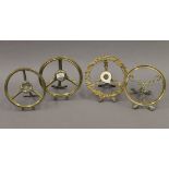 Four Victorian brass trivets