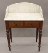 A Victorian mahogany marble topped wash stand. 75 cm wide.