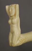 A walking stick with a carved bone handle formed as a nude lady. 93 cm long.