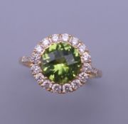 An 18 ct old, peridot and diamond ring. Ring size M.