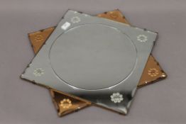 An Art Deco starburst wall mirror. 57 cm wide.