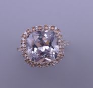 A silver cubic zirconia ring. Ring size P/Q.