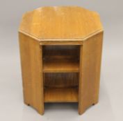 An Art Deco oak coffee table/bookcase. 61 cm high.