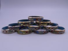 Ten cloisonne rings.