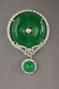 A circular jade pendant. 4.5 cm high.