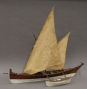 A scratch built wooden model catamaran. 90 cm long.