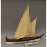 A scratch built wooden model catamaran. 90 cm long.