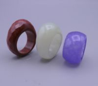 Three various dress rings. Ring sizes: jade N/O, purple K/M, gold stone Q/R.