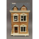 A vintage dolls house. 62 cm high.