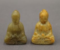 Two small carved soapstone models of buddhas. Each approximately 6 cm high.