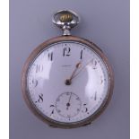 An Omega silver pocket watch. 5 cm wide.