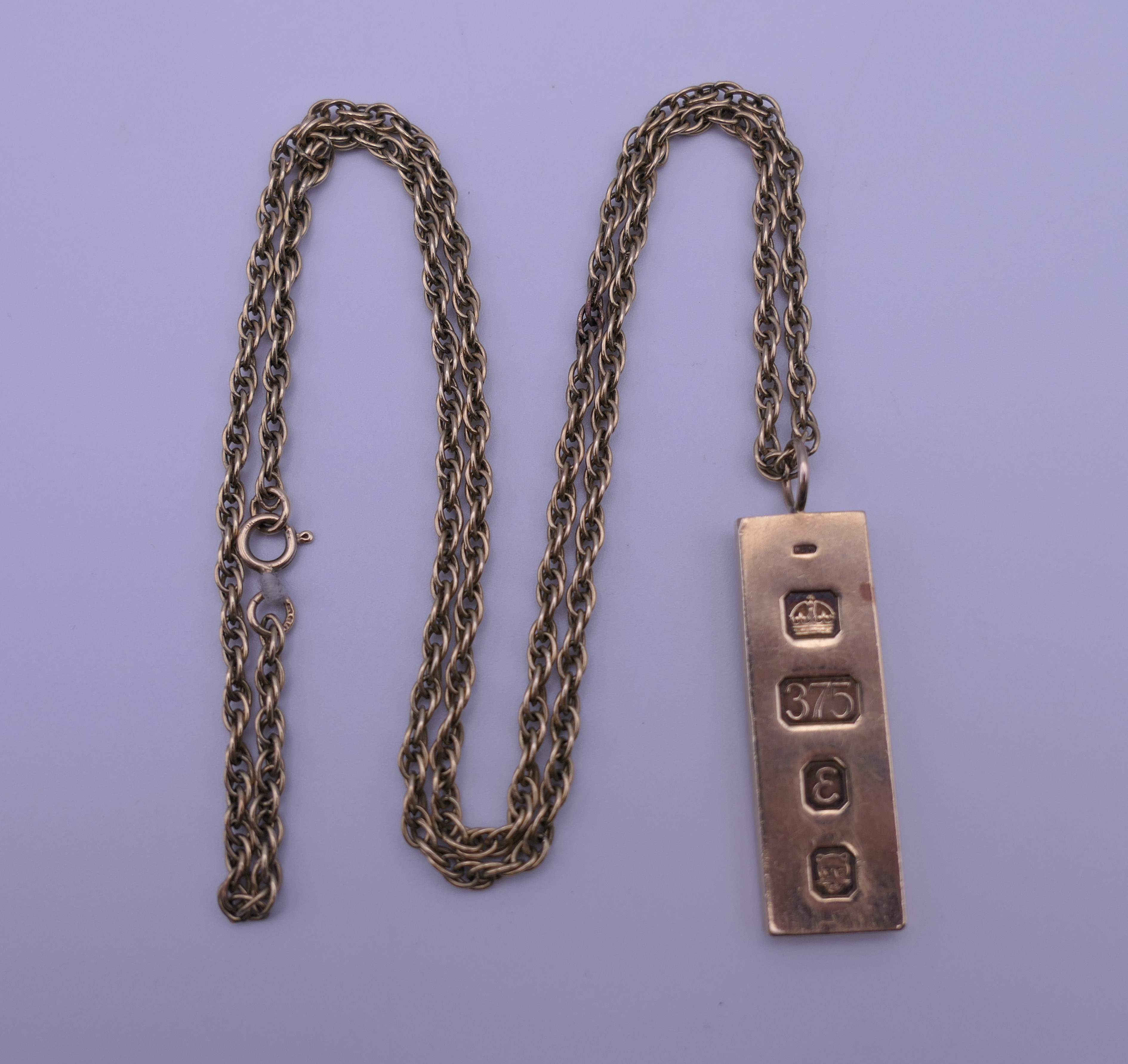 A 9 ct gold ingot on a 9 ct gold chain. 27.1 grammes. - Image 3 of 5