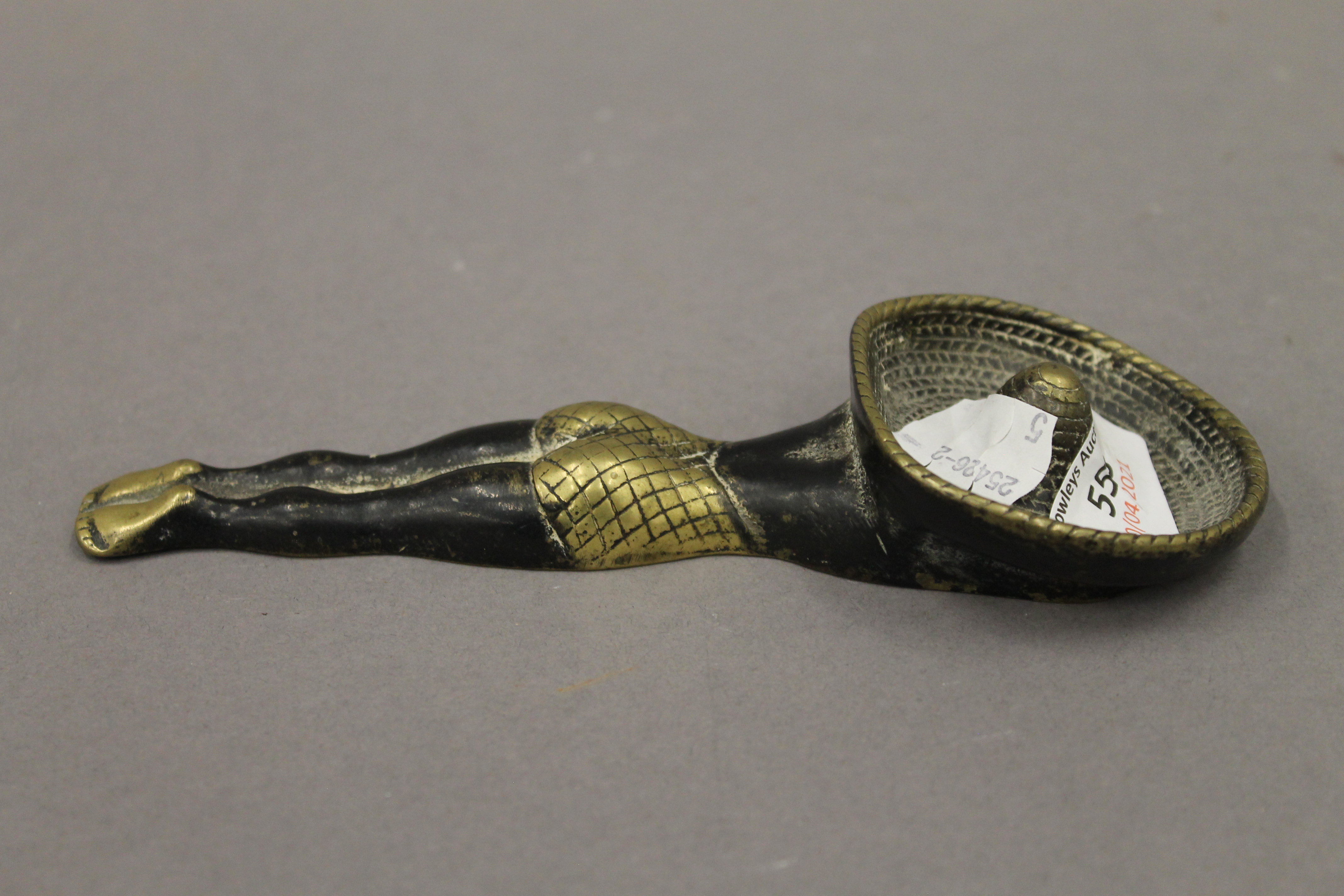 A brass novelty ashtray. 17.5 cm long.
