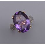 A 9 ct gold, amethyst and diamond ring. Ring size L/M.