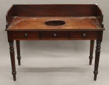 A Victorian mahogany wash stand. 114 cm wide.