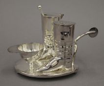 A silver plated riding boot cruet set. 9.5 cm high.