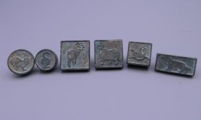 Six miniature bronze seals. The largest 2 cm long.