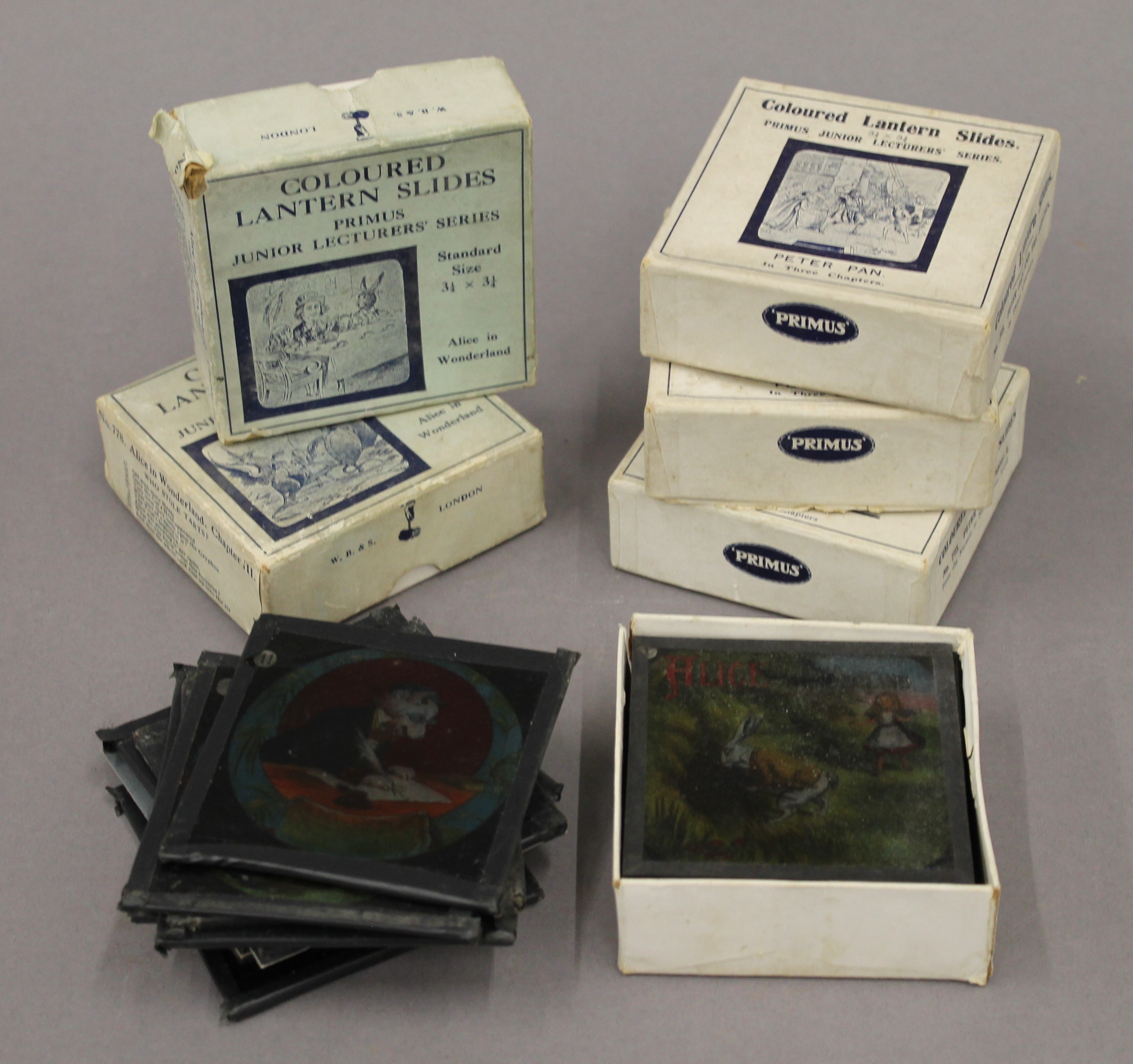 A quantity of Alice in Wonderland magic lantern slides and others.