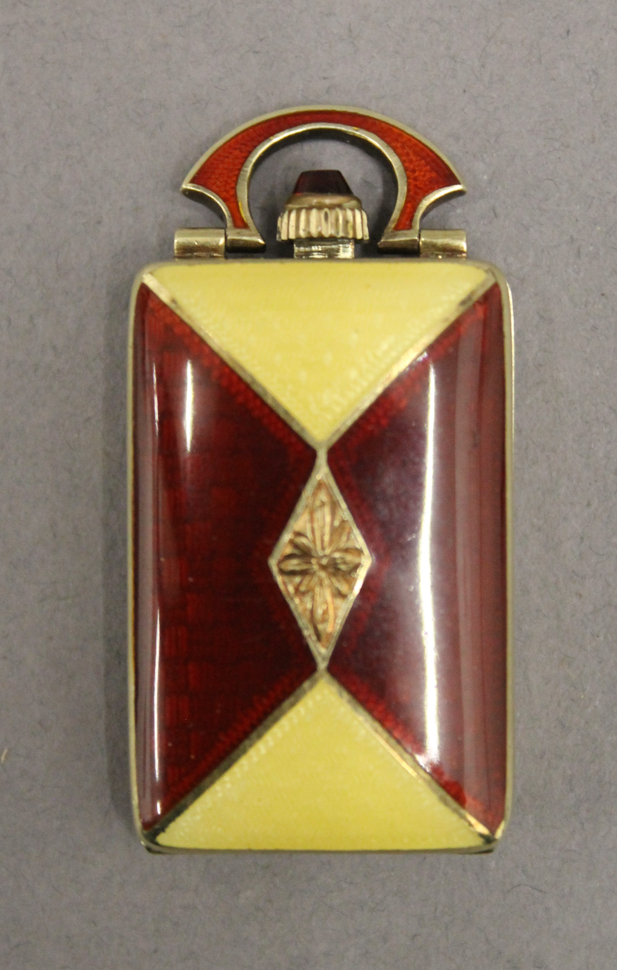 A 14 ct gold and enamel cased purse watch. 4.25 cm high.