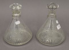 A pair of engraved ships decanters. Each 22 cm high.