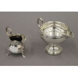 Two silver cream jugs. The largest 8 cm high. 3.9 troy ounces total weight.