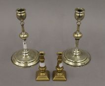 A pair of 19th century solid brass Polish candlesticks, stamped Norblin and Co Warszawa,