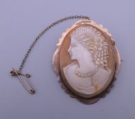A 9 ct gold mounted Victorian cameo brooch. 4 cm high.