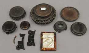 A quantity of Chinese stands, together with a tortoiseshell and mother-of-pearl card case.