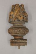 An 18th century and possibly earlier, carved oak finial. 25 cm high.